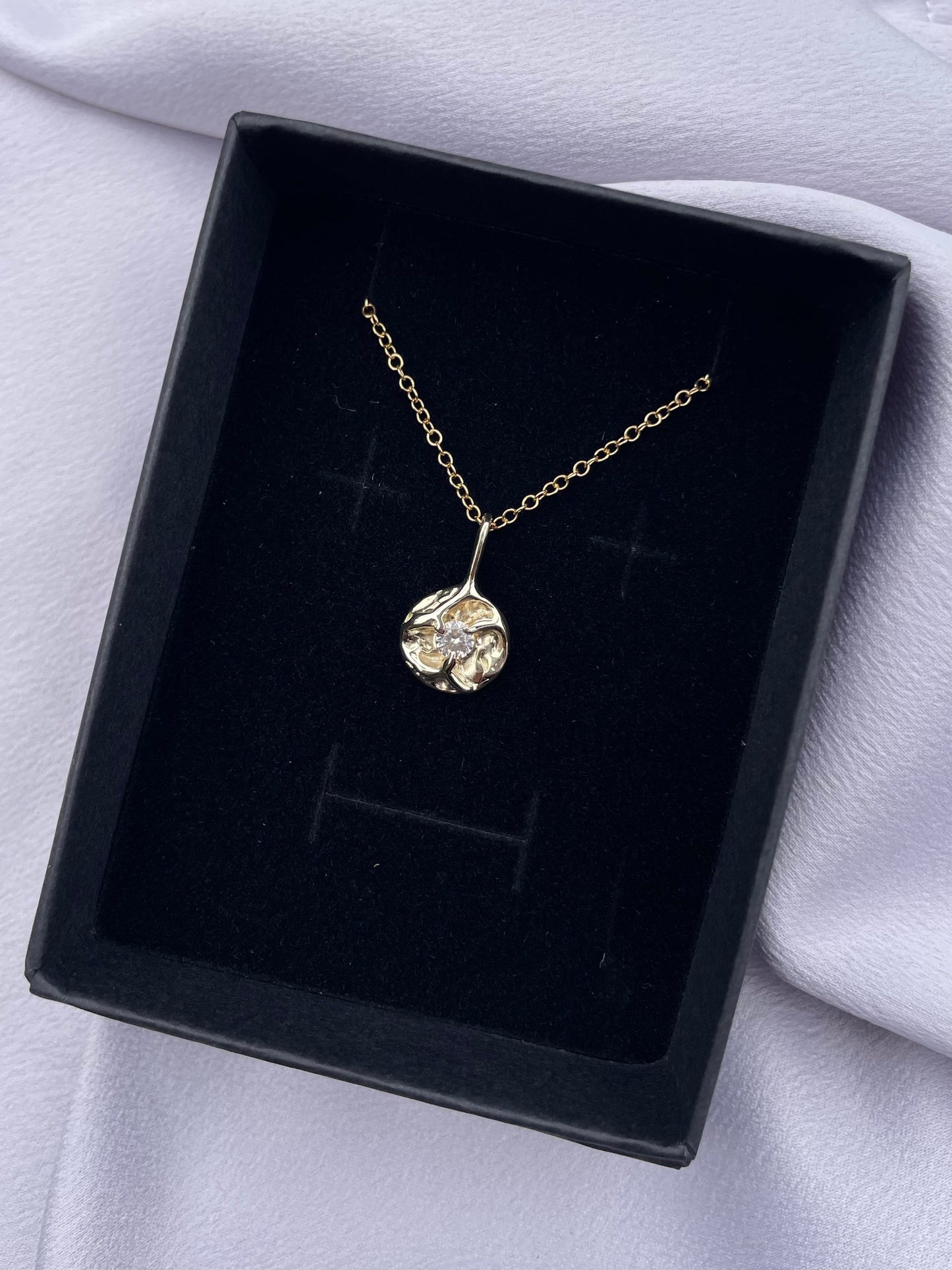 Tasmanian Zircon 9ct gold coin pendant